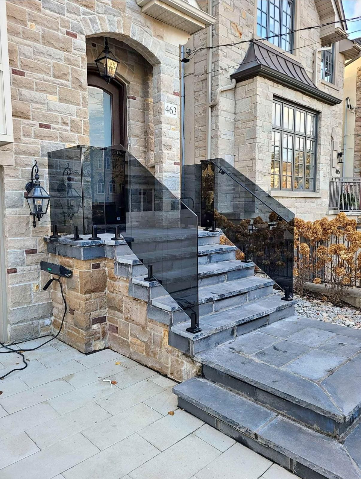 Grey-tinted glass on flagstone steps