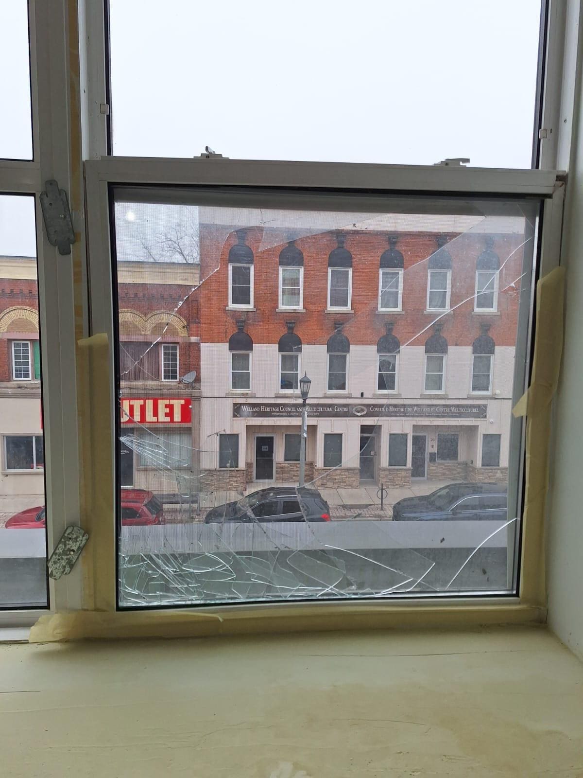 Upper-floor window over a main street, replaced