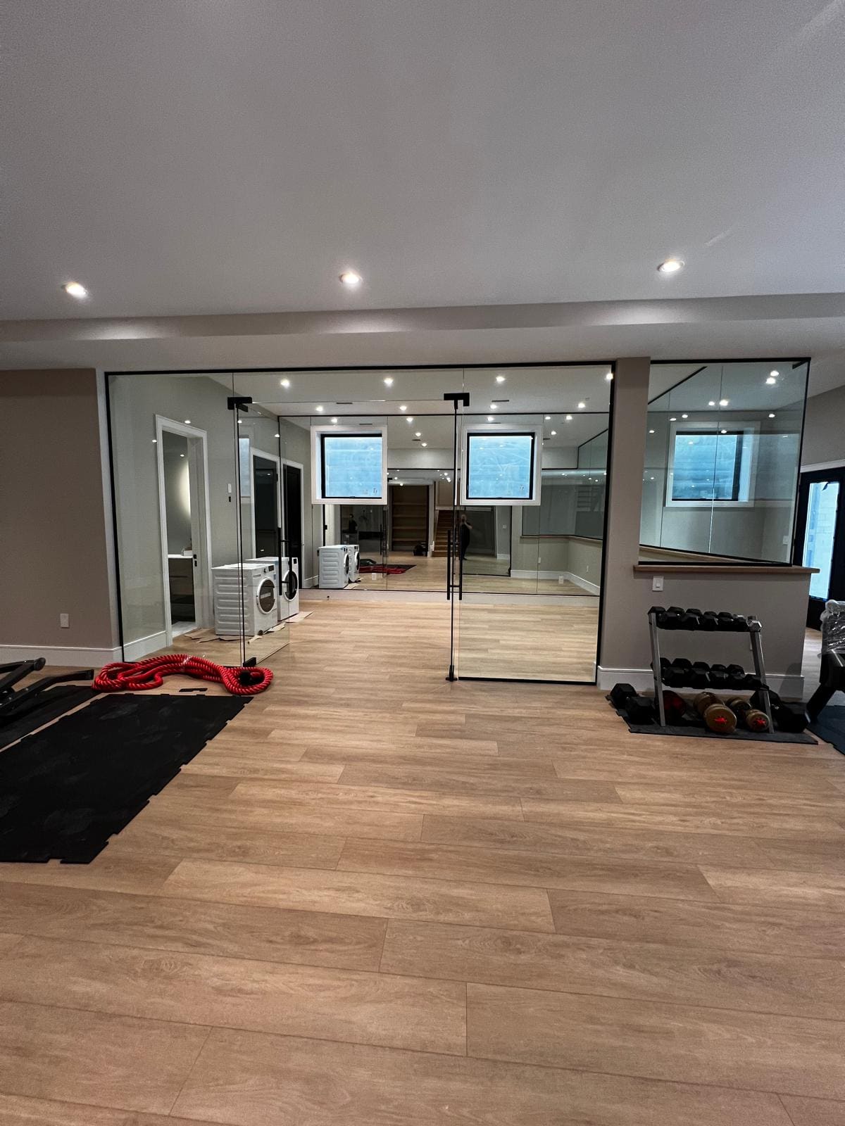 Glass wall and door closing off a home gym