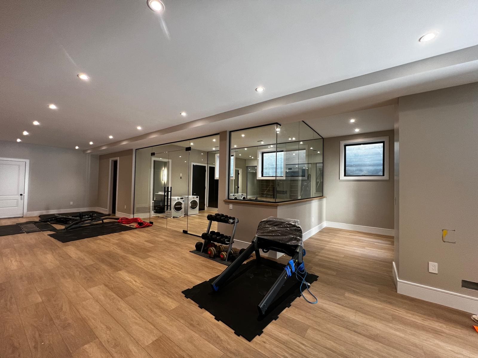 Glass wall and door closing off a home gym