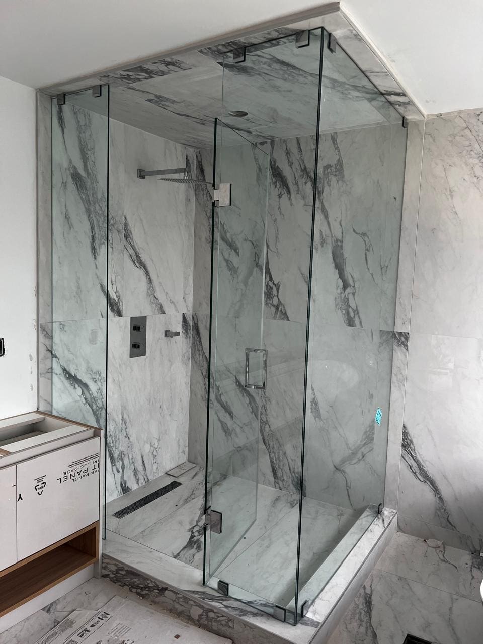 Glass shower enclosure