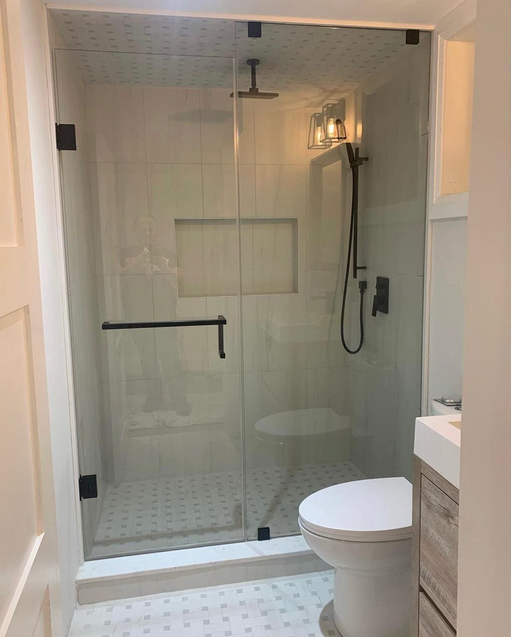 Glass shower enclosure