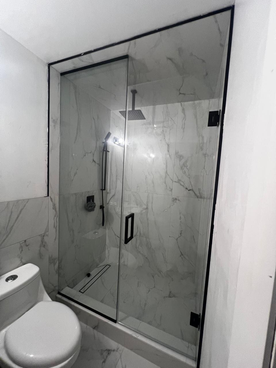 Glass shower enclosure