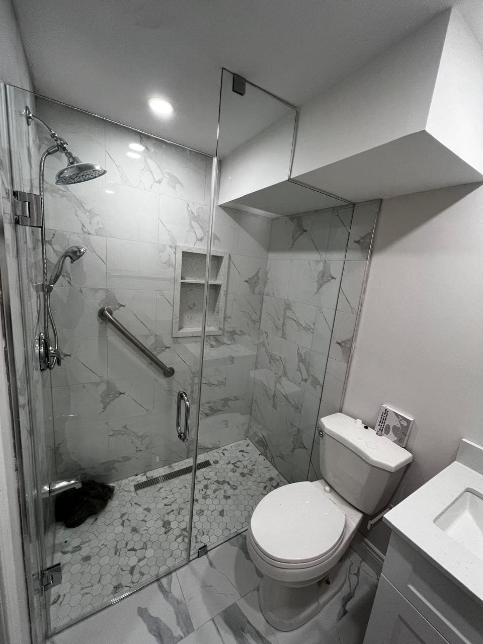 Glass shower enclosure