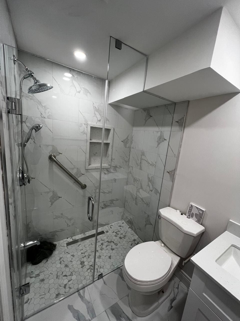 Glass shower enclosure