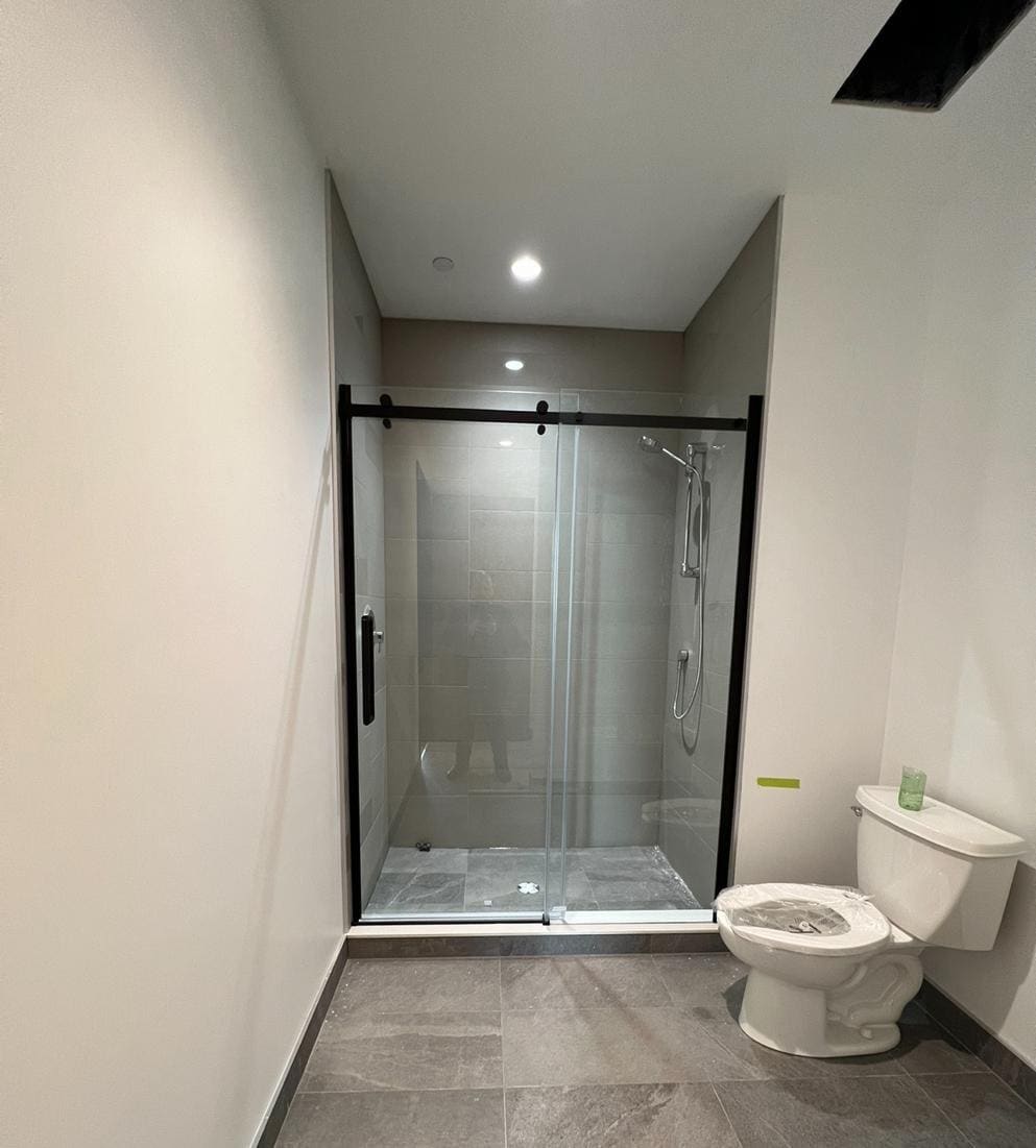 Glass shower enclosure