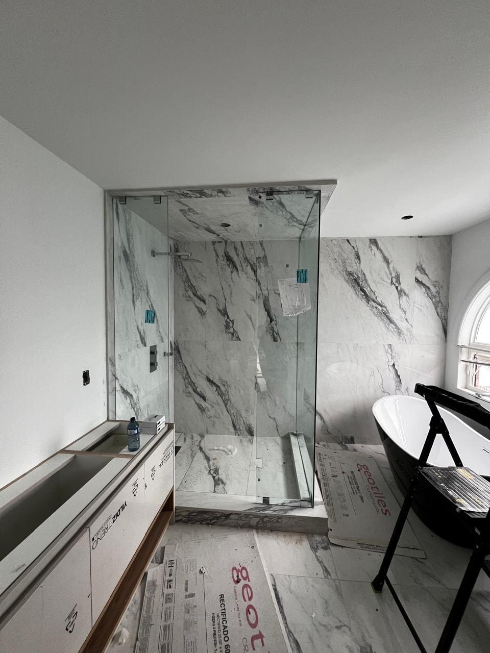 Glass shower enclosure
