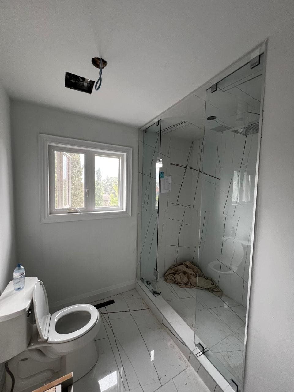 Glass shower enclosure