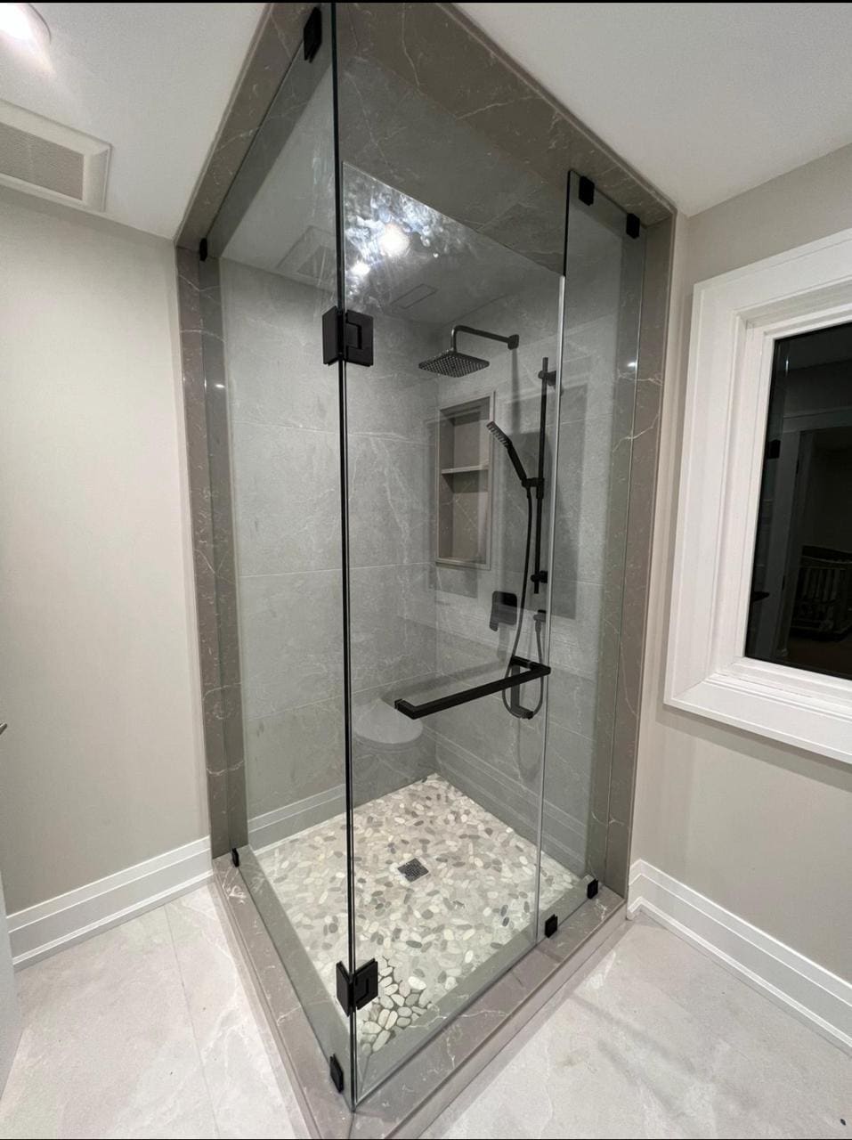 Neo-angle shower with black hardware